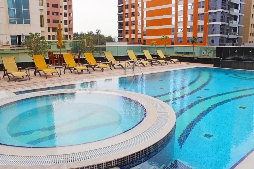 Фотография Dunes Hotel Apartments Oud Metha 4*