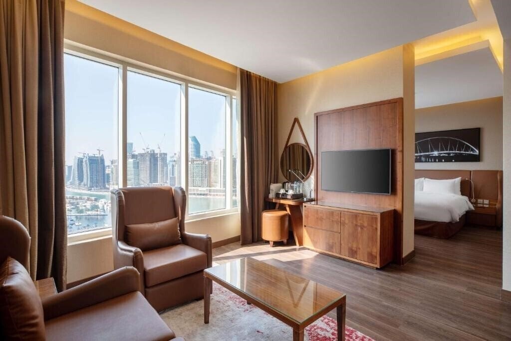 Фото Radisson Blu Hotel, Dubai Canal View 5*
