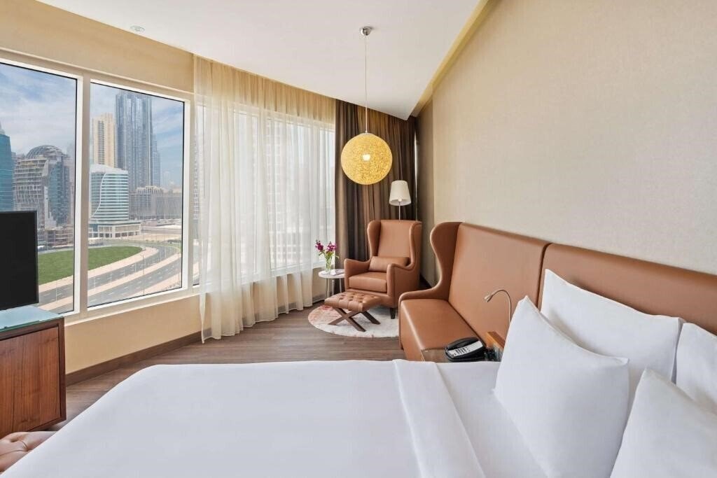 Фото Radisson Blu Hotel, Dubai Canal View 5*