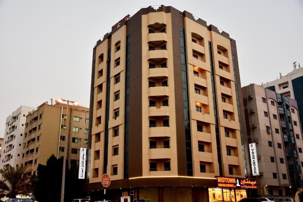 Готель Midtown Furnished Apartments 3*
