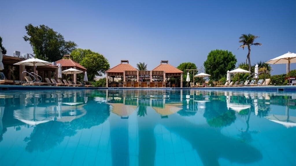 Фотографія Umm Al Quwain Beach Hotel 4*