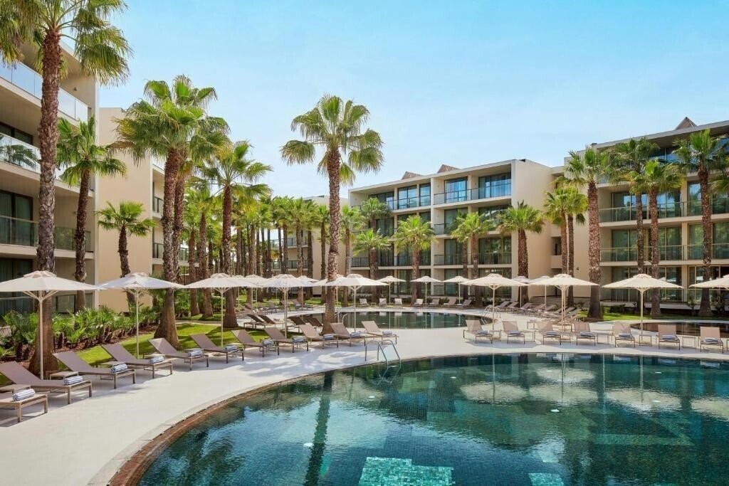 Отель Salgados Palm Village Apartments & Suites 4*