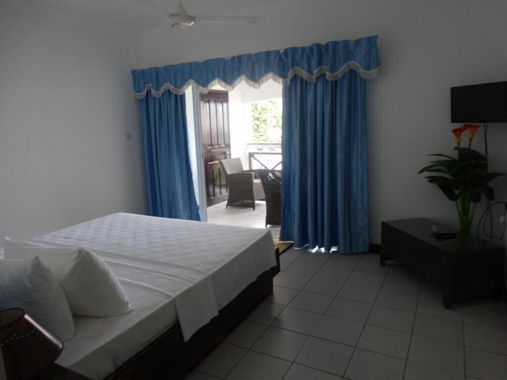 Фото Anse Norwa Self Catering Apt апартаменты