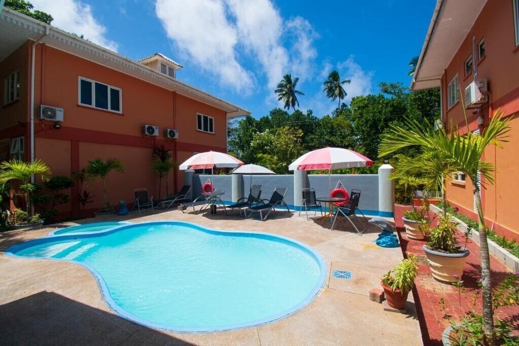 Фотография Reef Holidays Apartments 4*