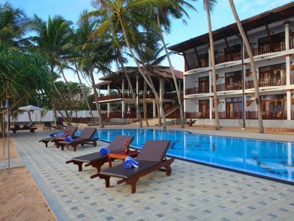 Фото Whispering Palms 3*