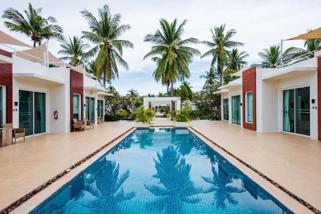 Отель The Beach Village 4*