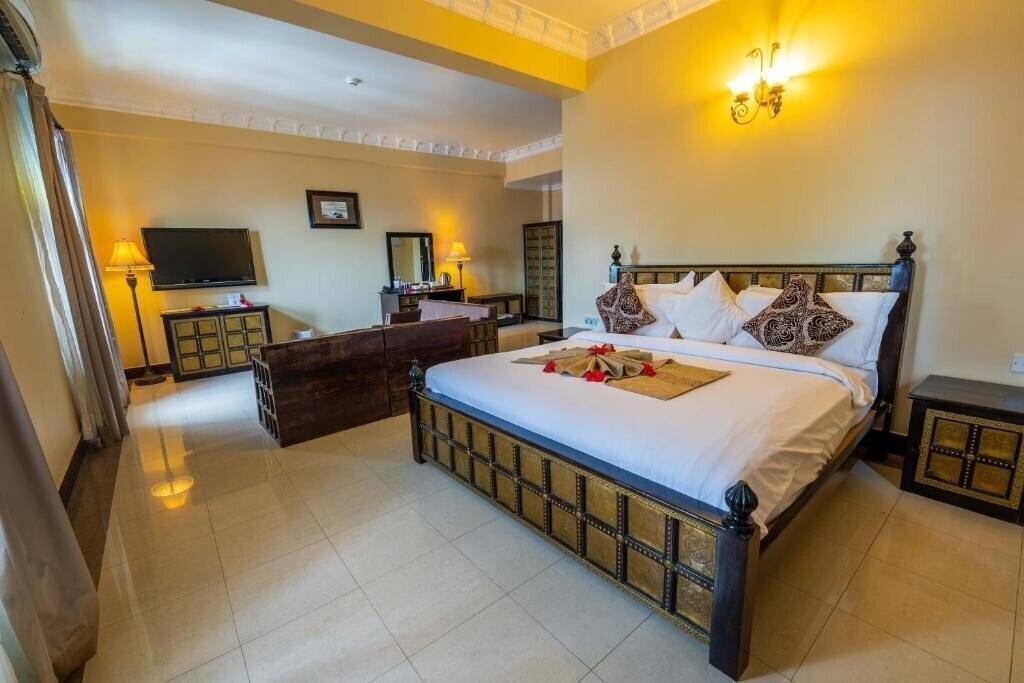 Фотографія Golden Tulip Stone Town Boutique Hotel 4*