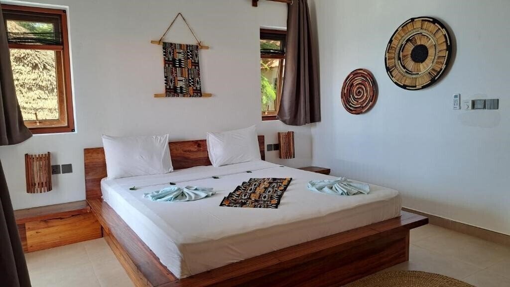 Фото Aluna Beach Apartments (Nungwi) 4*