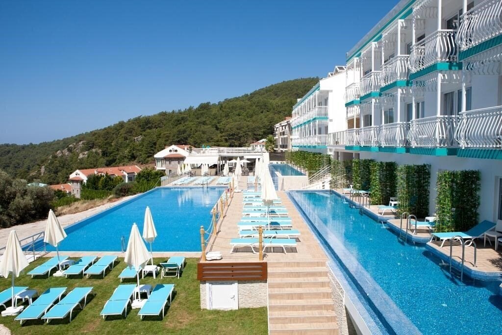 Отель Sertil Deluxe Hotel & SPA (ex. Tropical Suites by Sertil, Ramada by Wyndham Fethiye Oludeniz) 4*