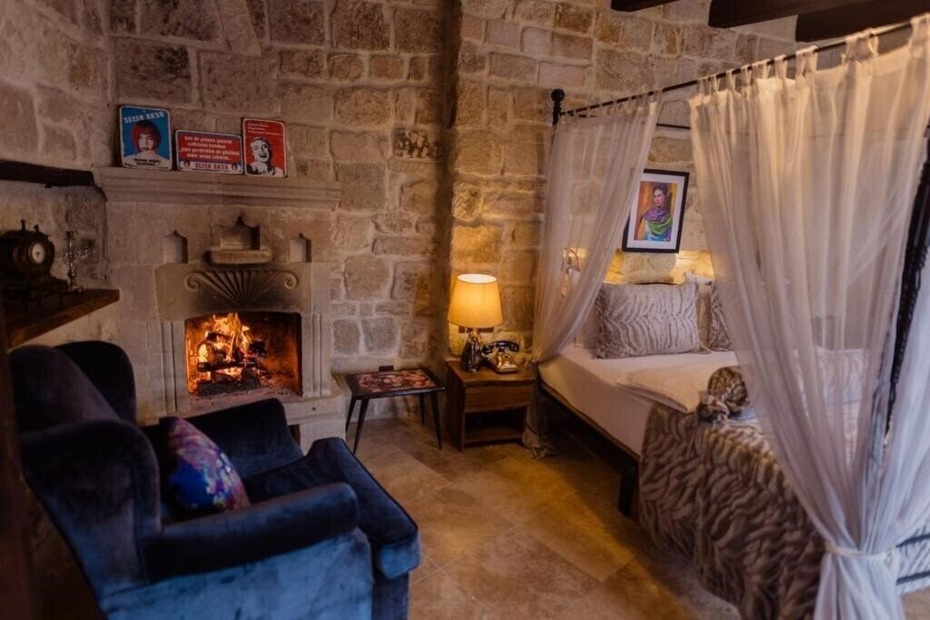 Фотографія Asuwari Suites Cappadocia 4*