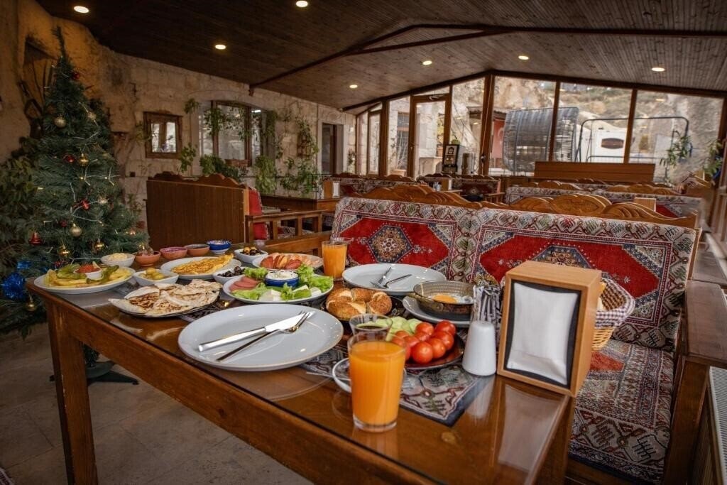 Фотографія Zeus Cave Suites 4*