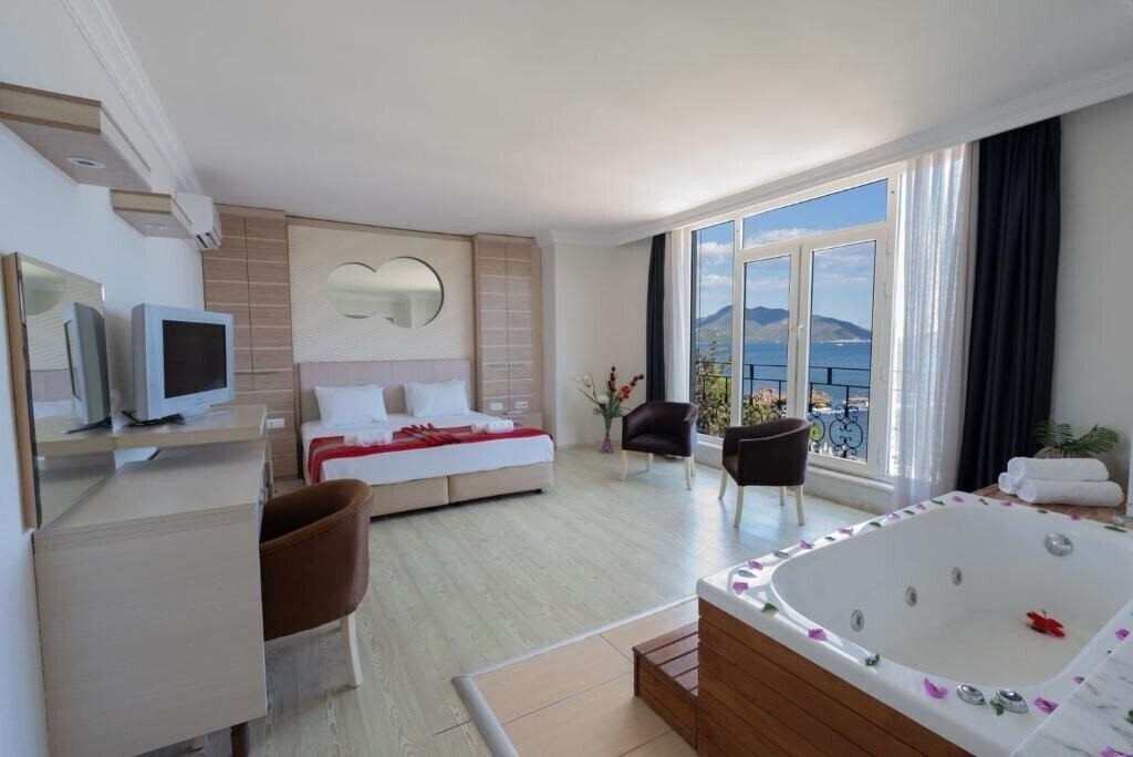 Фотографія Hotel Caprea Beach (ex. Dora Beach Boutique Hotel, Dora Beach Marmaris, Karacan Beach) 4*